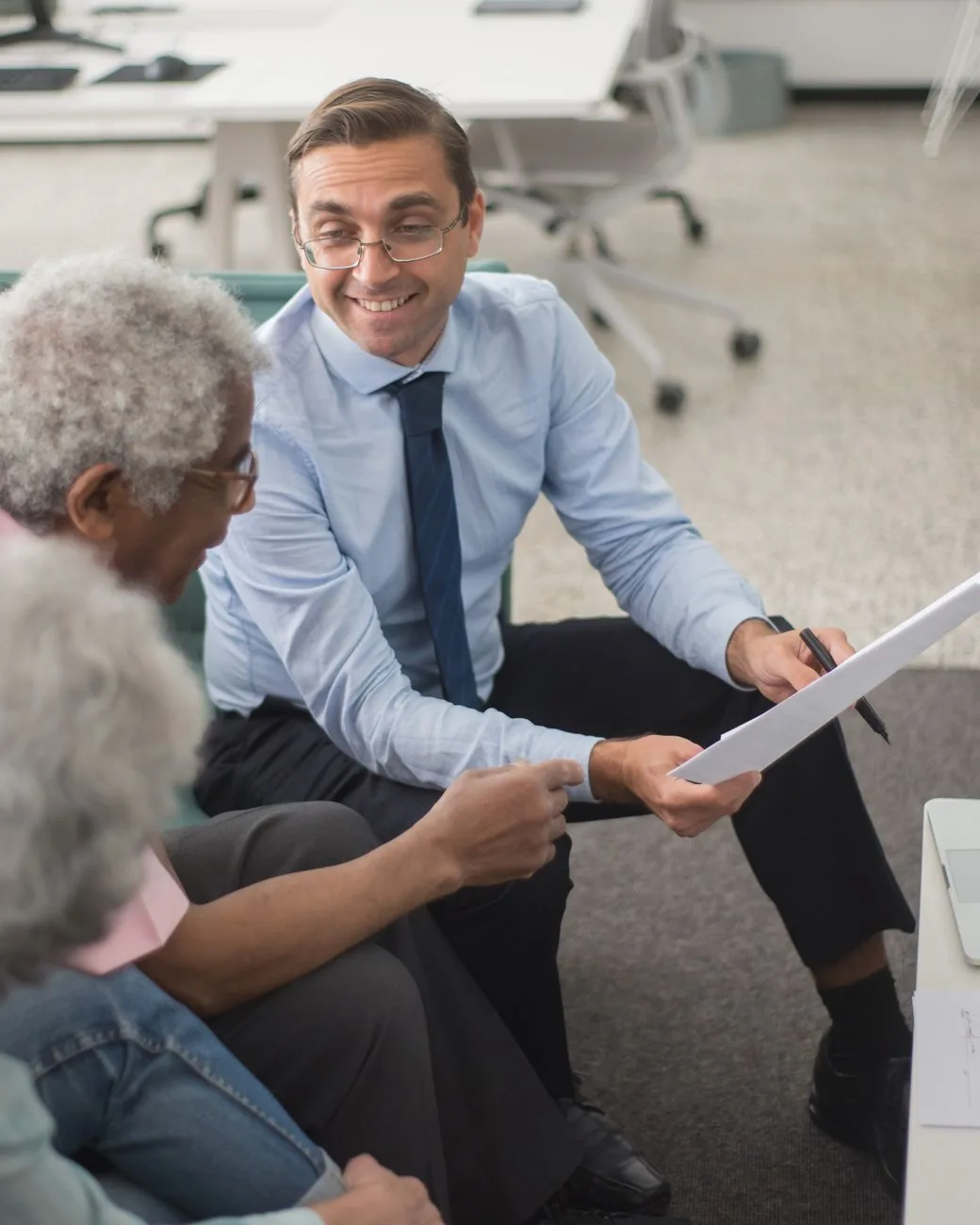 A North Harbor advisor walking a couple through their retirement plan in a calm office