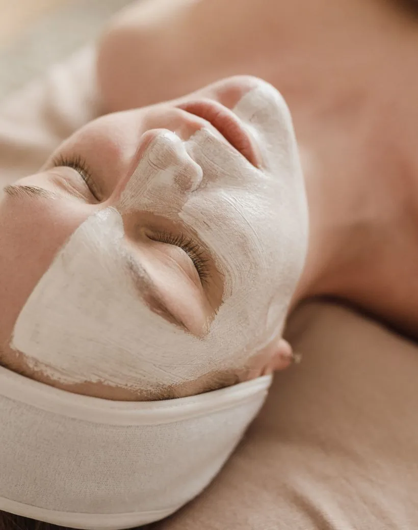 A member resting through a quiet facial at The Glow Room, warm north light
