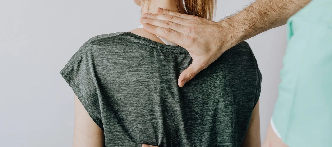 Meridian Spine Studio — a careful, hands-on neck and spine assessment in a calm treatment room