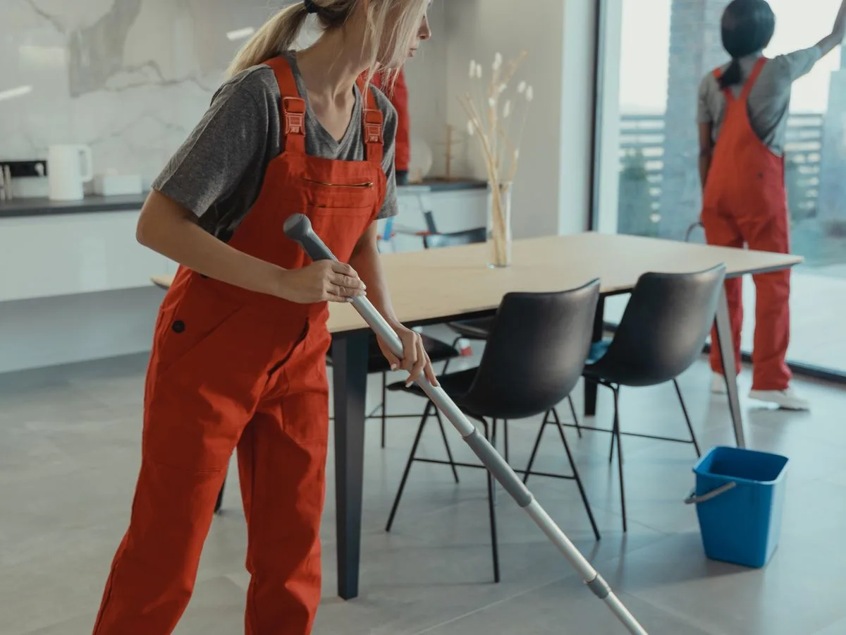 A Meridian crew member cleaning a workspace after hours