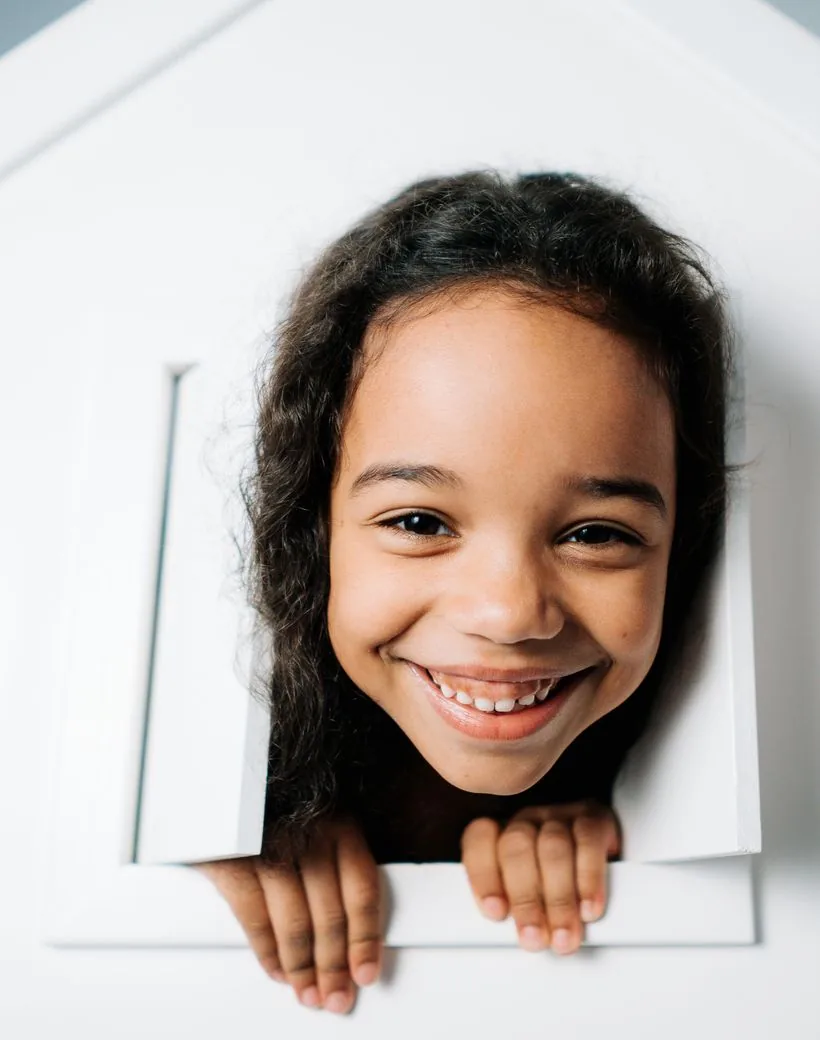 A happy young patient beaming after her visit to Northstar Kids