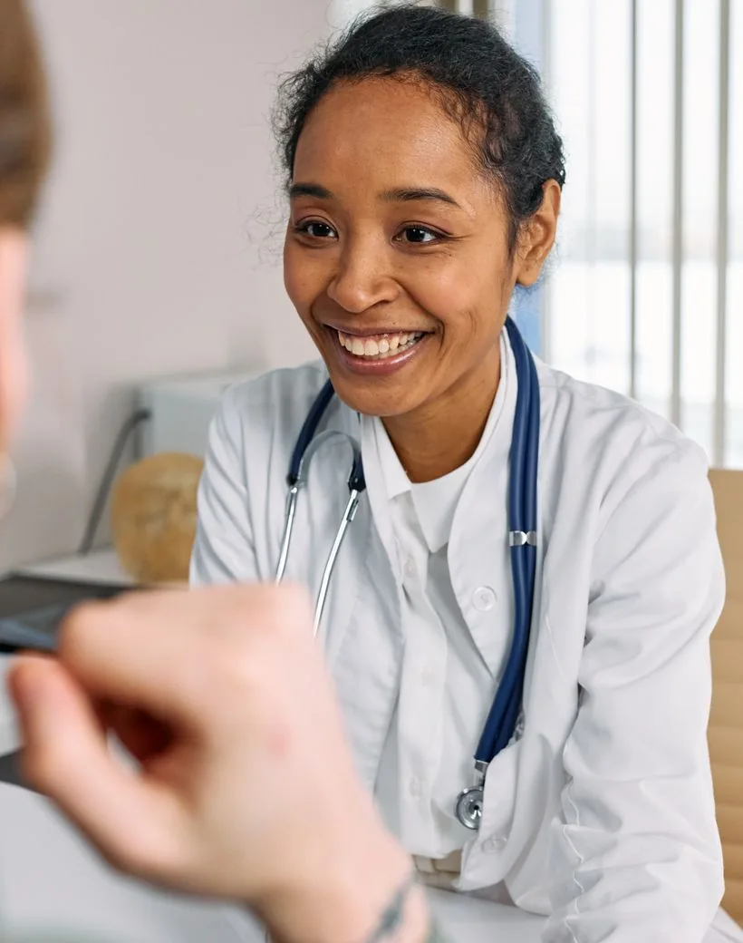 A Cedarpath doctor talking warmly with a patient
