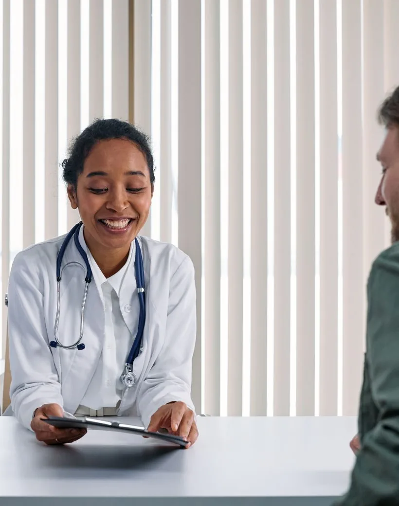 A Meridian physician reviewing care with a member