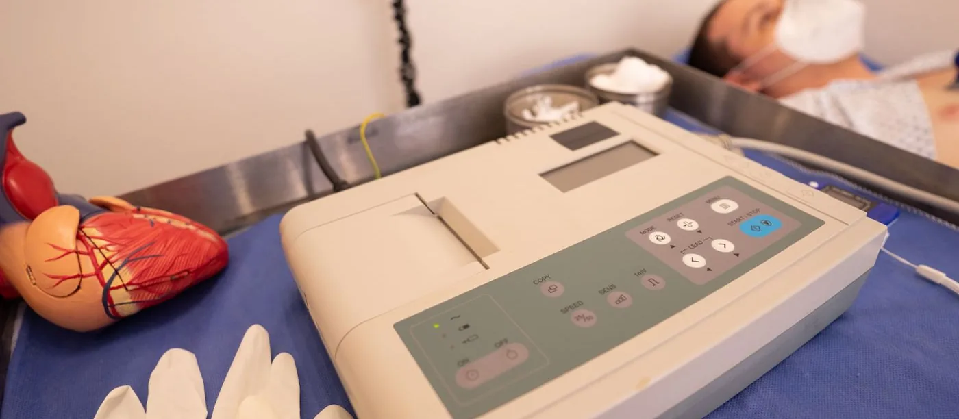 Northvale Cardiology — heart model beside an ECG machine