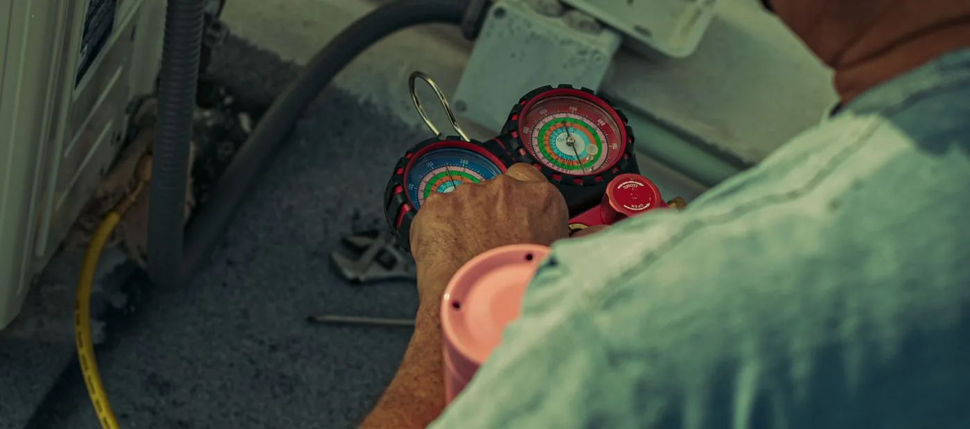 TrueNorth Heating & Air — technician servicing a home air-conditioning system