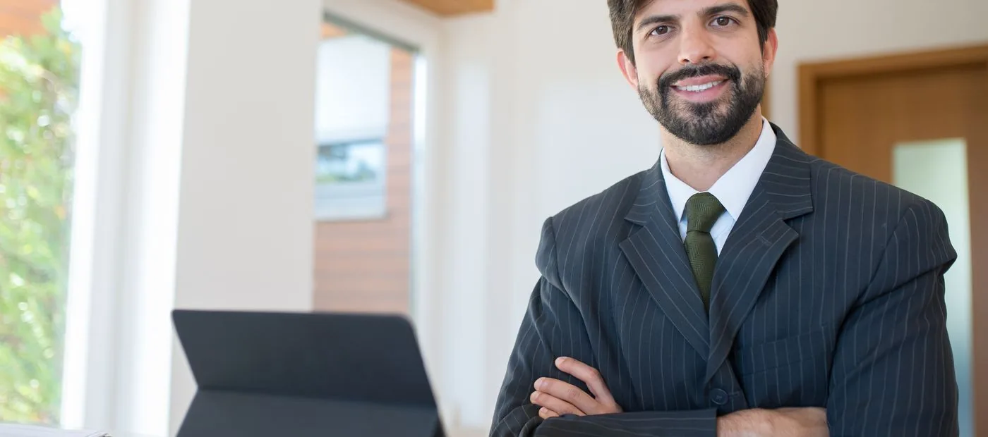 Confident advisor in a tailored suit in a bright modern office