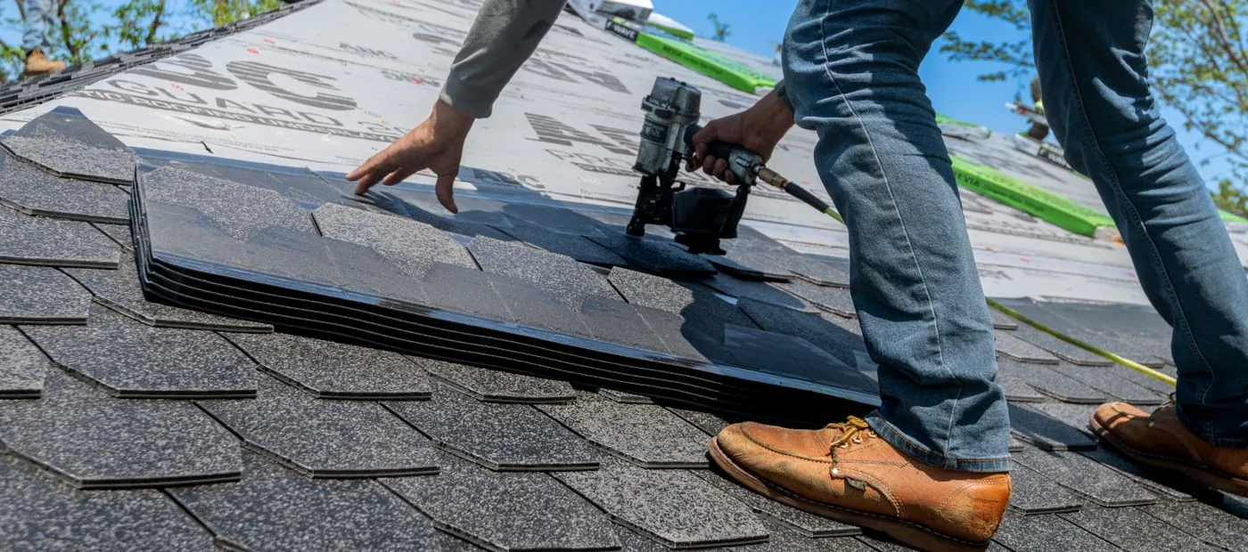 Summit Roofing — installing new asphalt shingles on a residential roof
