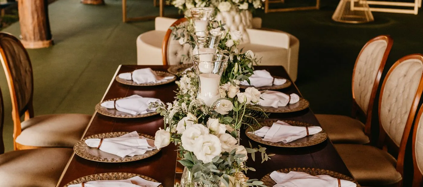Ever & After Weddings — an elegant reception tablescape with florals and candlelight