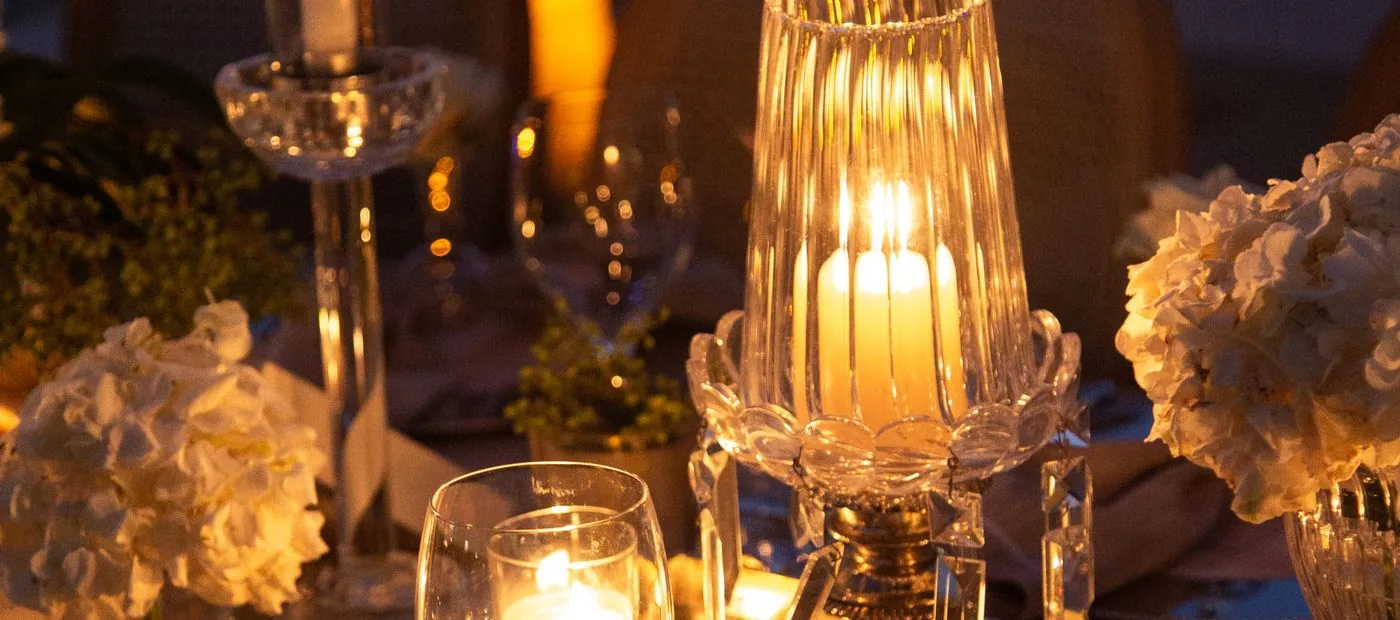 Maison Lumiere — a candlelit luxury wedding reception glowing in gold and crystal