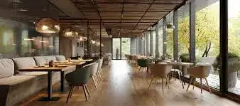 Restaurant interior with warm lights and wooden tables