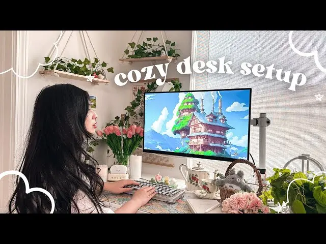 Creator working on laptop in a cozy studio with warm lights